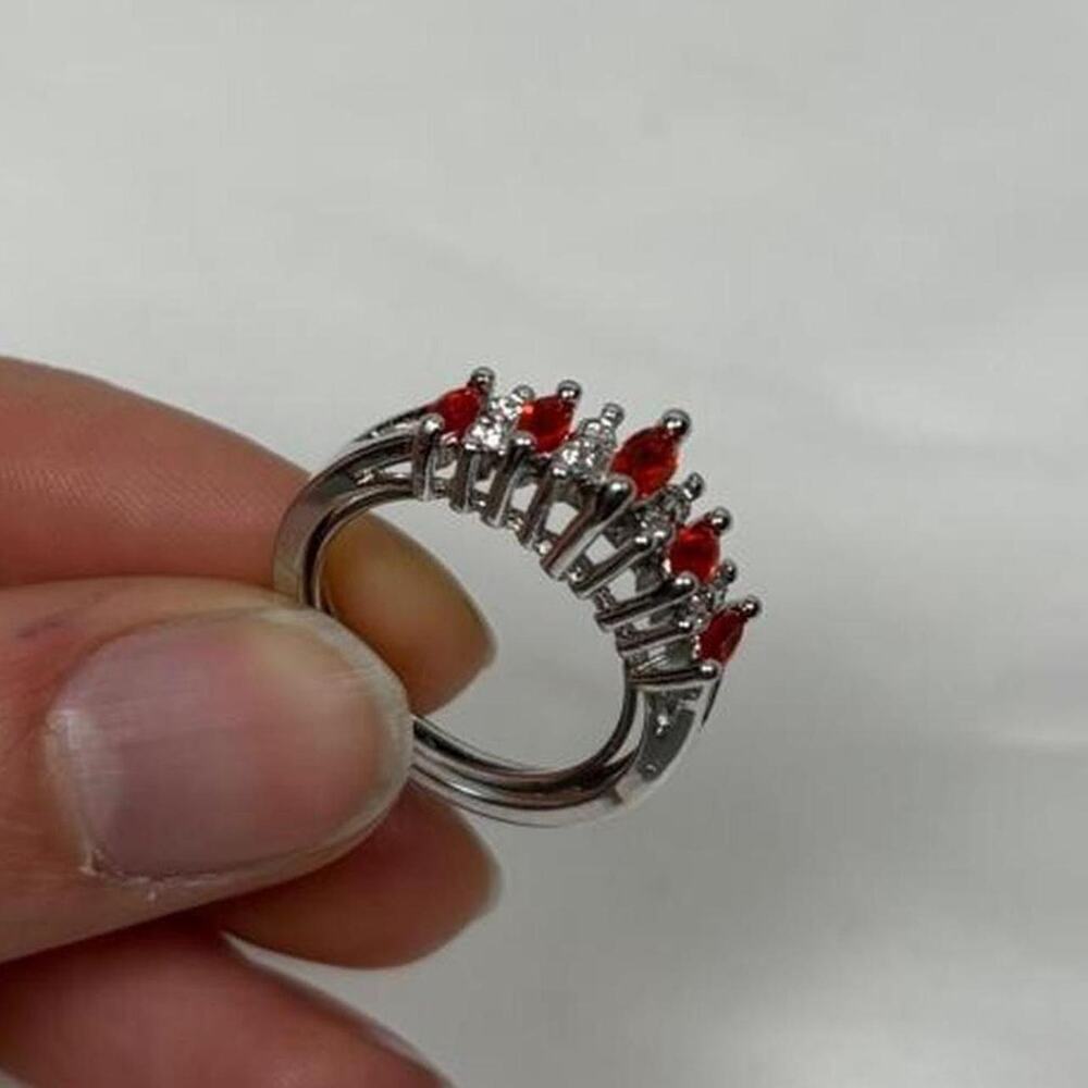Red and silver ring with red stones